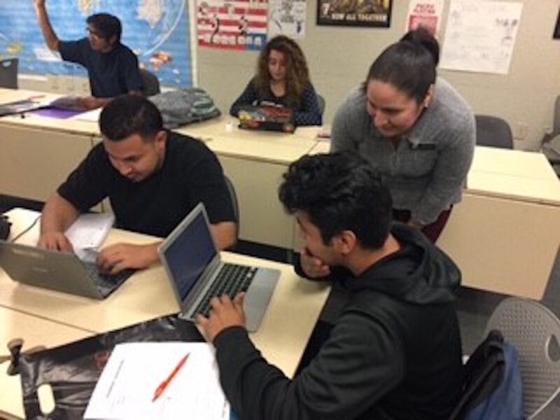 Staff helping students